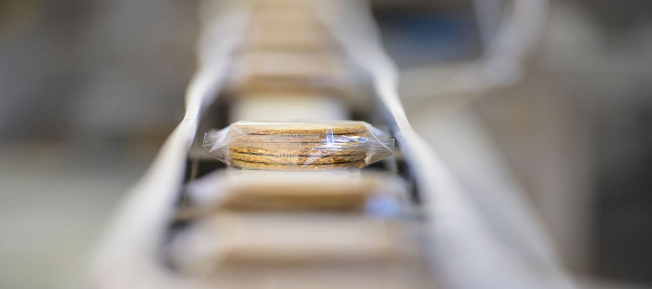package of biscuits on assembly line