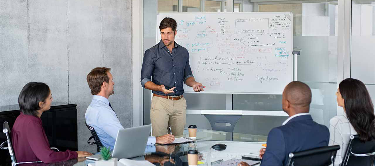 man giving presentation business partners