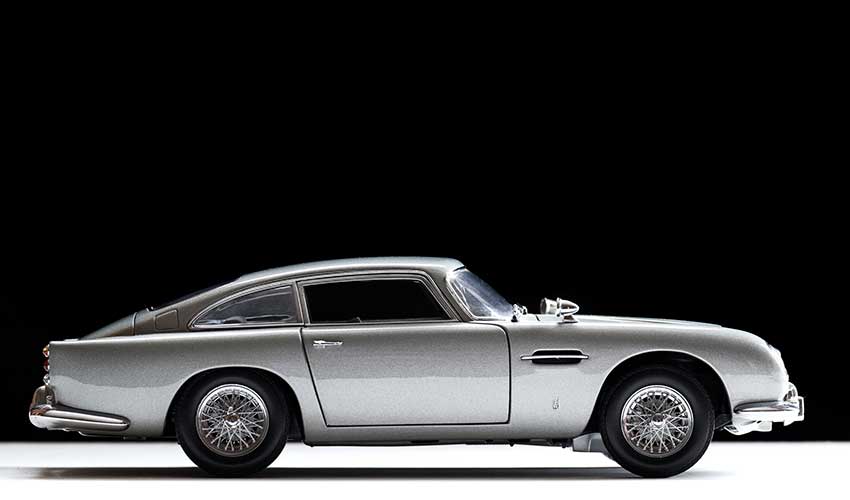 A vintage black and white Aston Martin