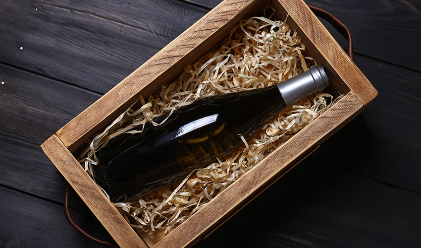  A collectible wine bottle in a wooden crate