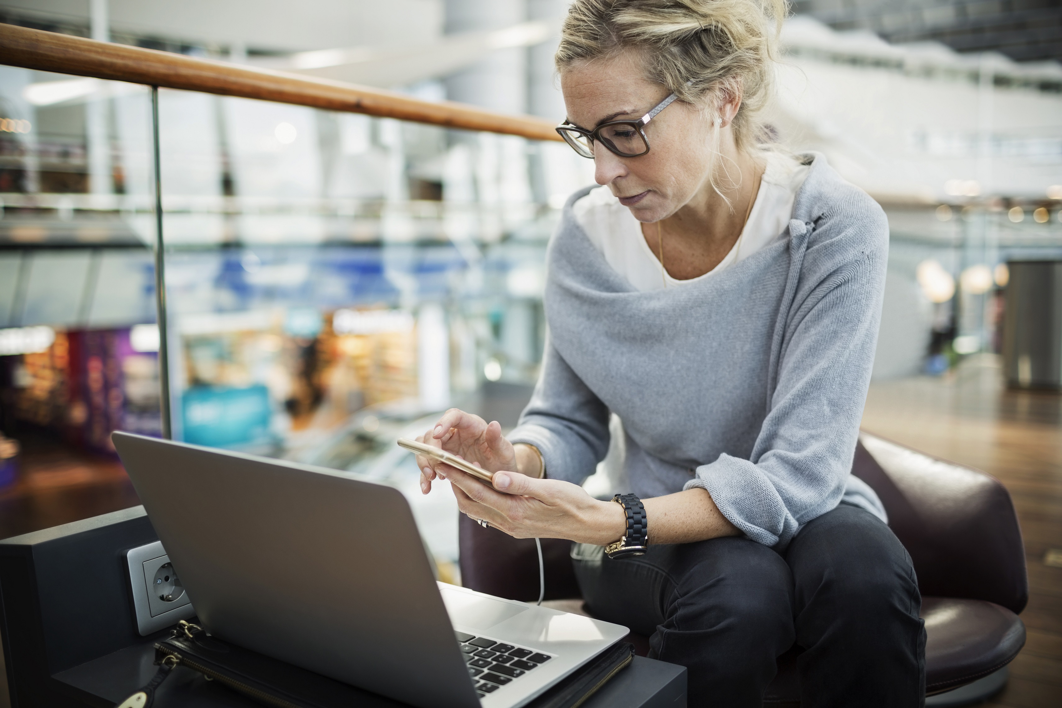 a man sitting at a table with a laptop
