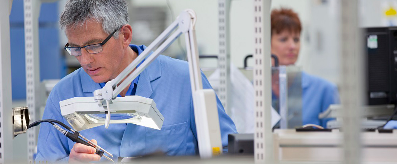 Technicians in hi-tech electronics manufacturing plant