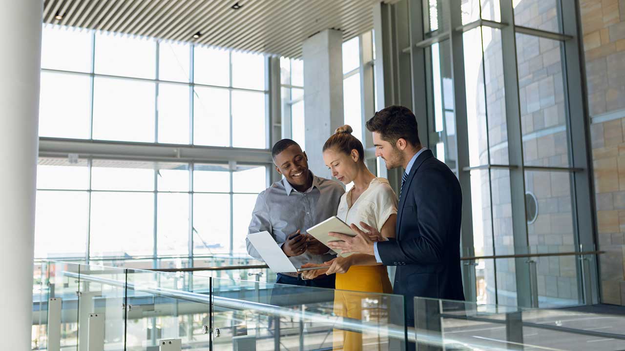 colleagues looking at tablet