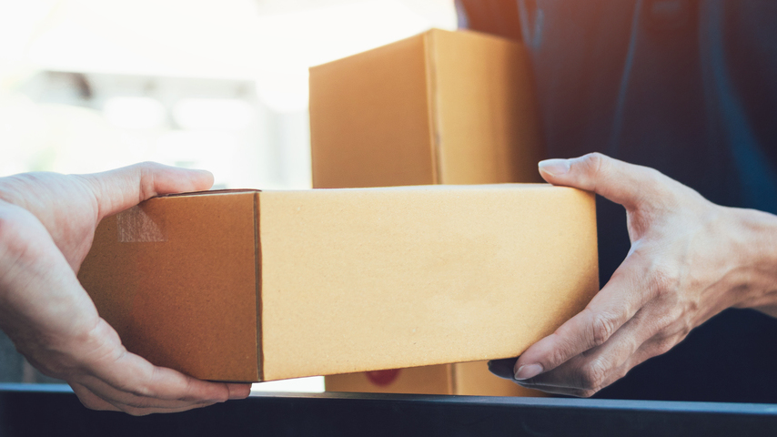 a hand holding an object in his hand