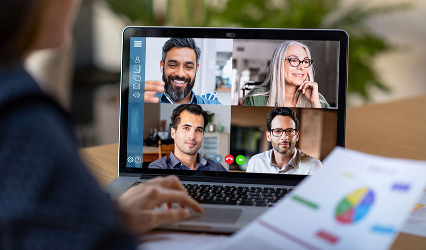 a couple of people that are looking at a laptop