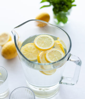 a jar of water with slices of lemon