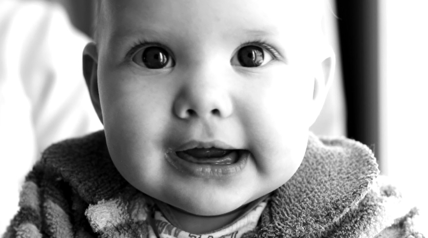 a close up of a baby looking at the camera