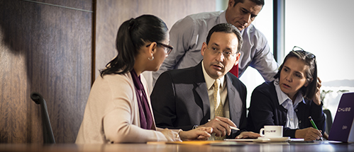 a group of people sitting at a table