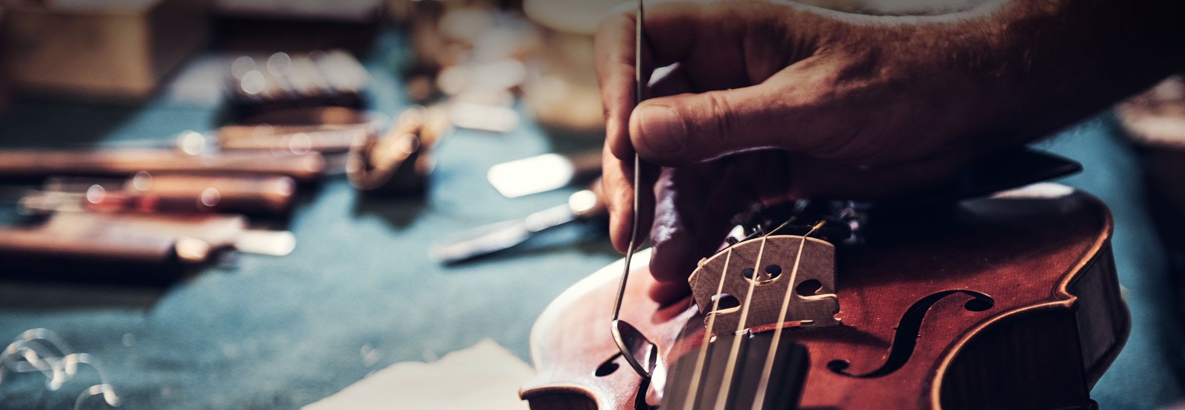 a close up of a person holding a guitar