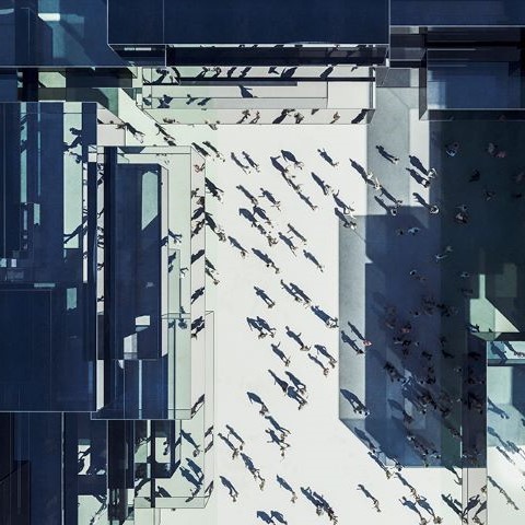 birds eye view of people walking in commercial building plaza