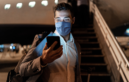 businessman in protective mask airport