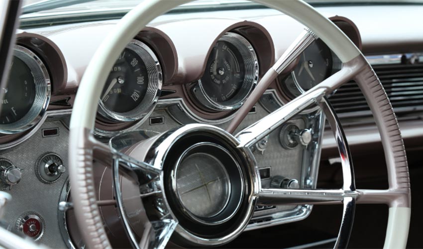 The steering wheel and dashboard of a classic car