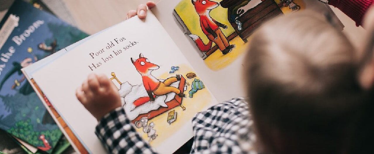 child reading storybook