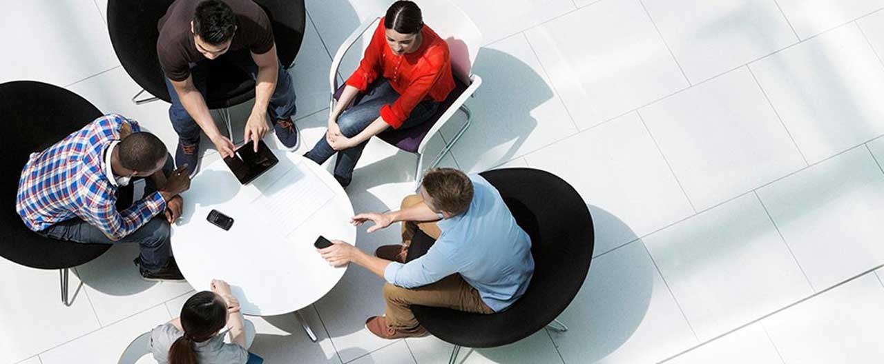 group of people around the round table