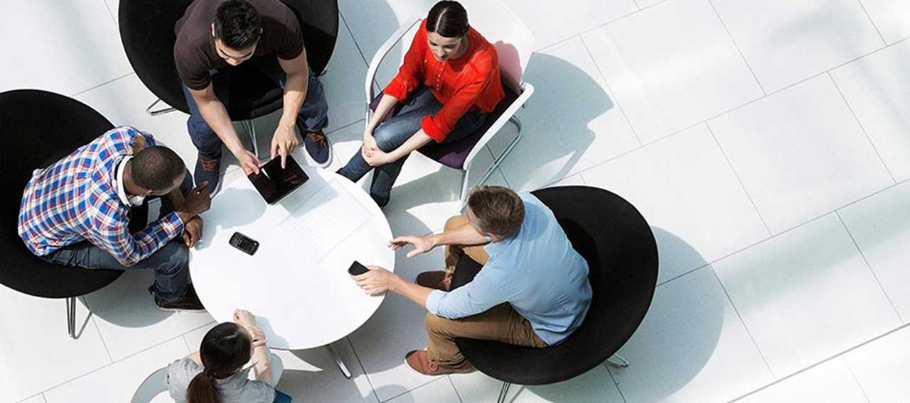 group of people around the round table