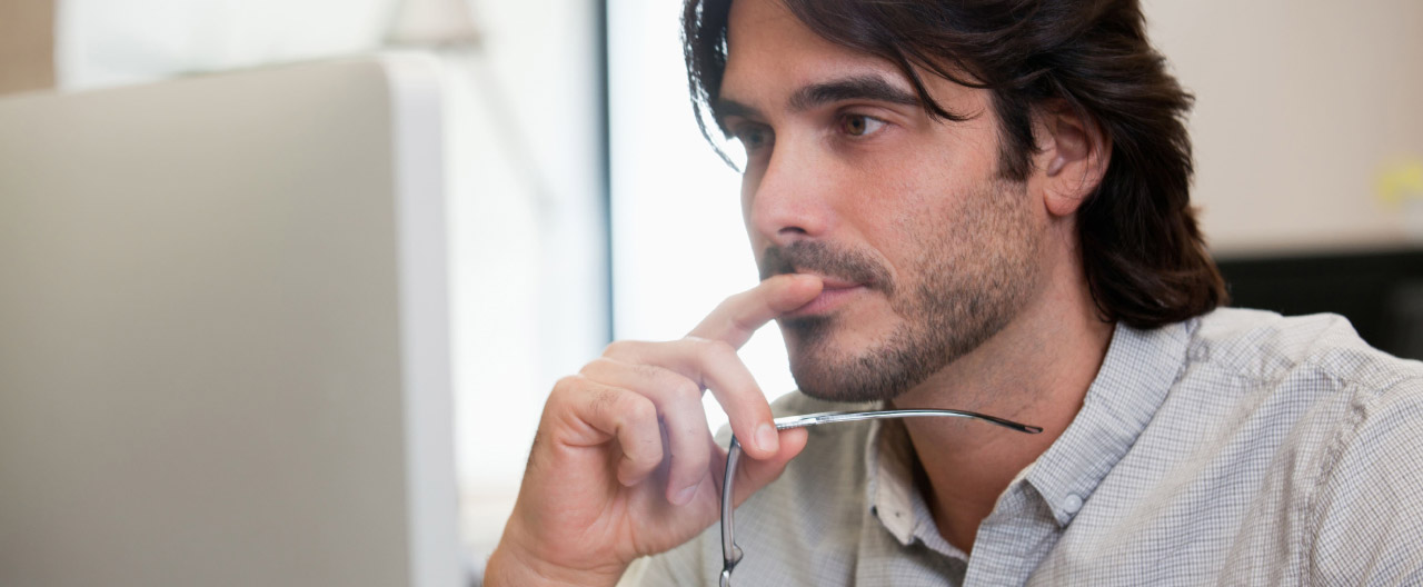 man looking at computer