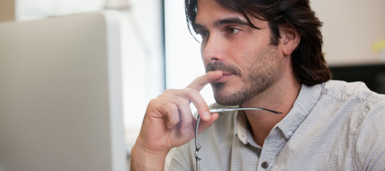 man looking at computer