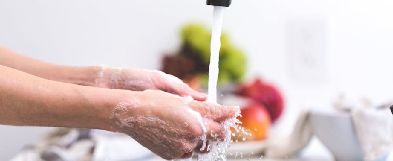 rinse hands in the kitchen sink