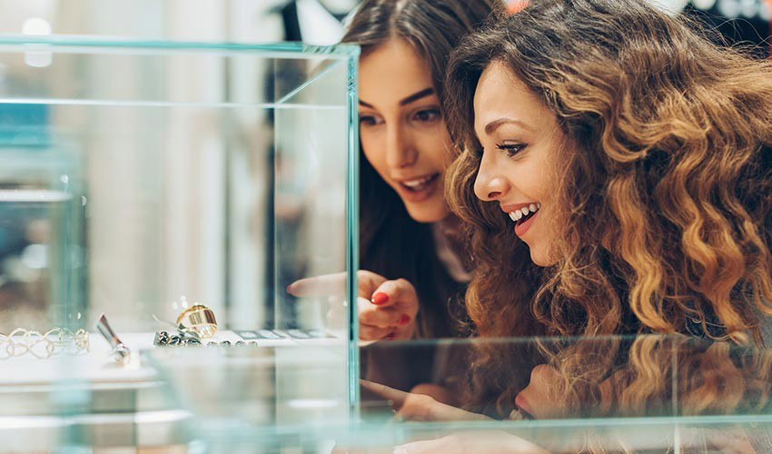 two women looking at jewelry