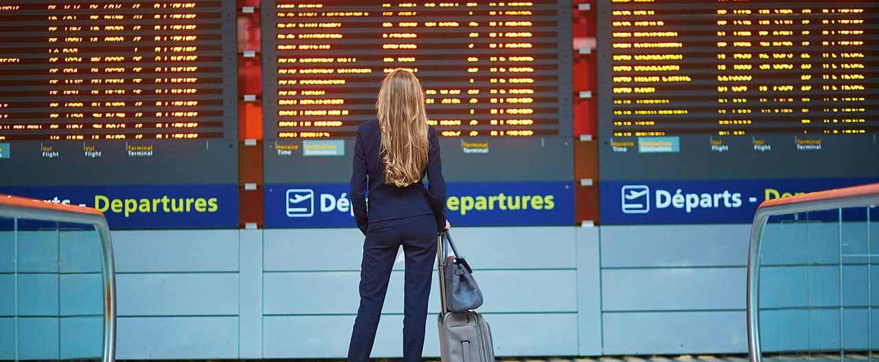 Woman in airport checks flight information