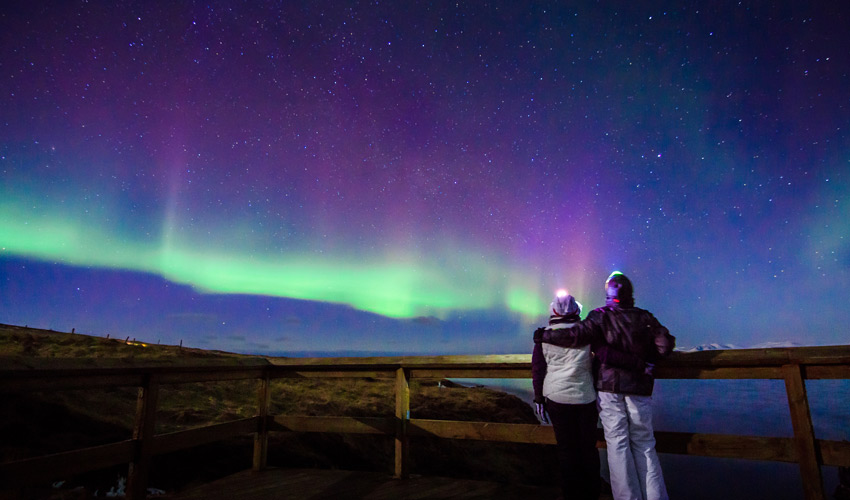 Watch the Northern Lights dancing across the night sky 