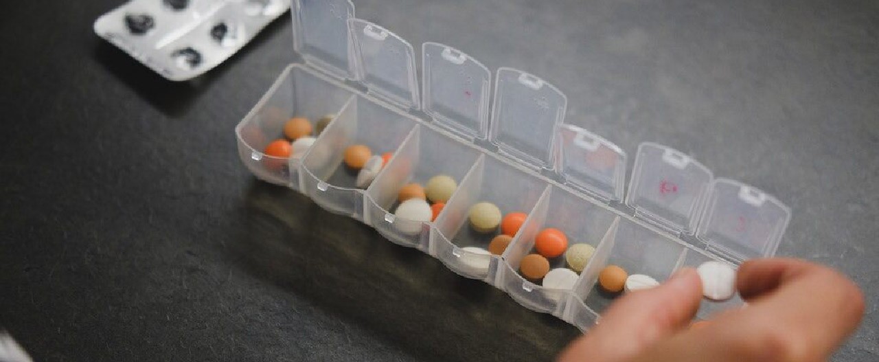 filling up pill organizer