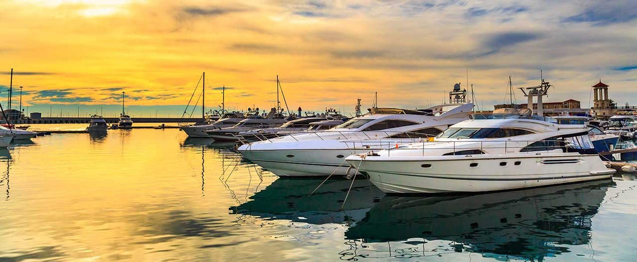 luxury yachts at sunset