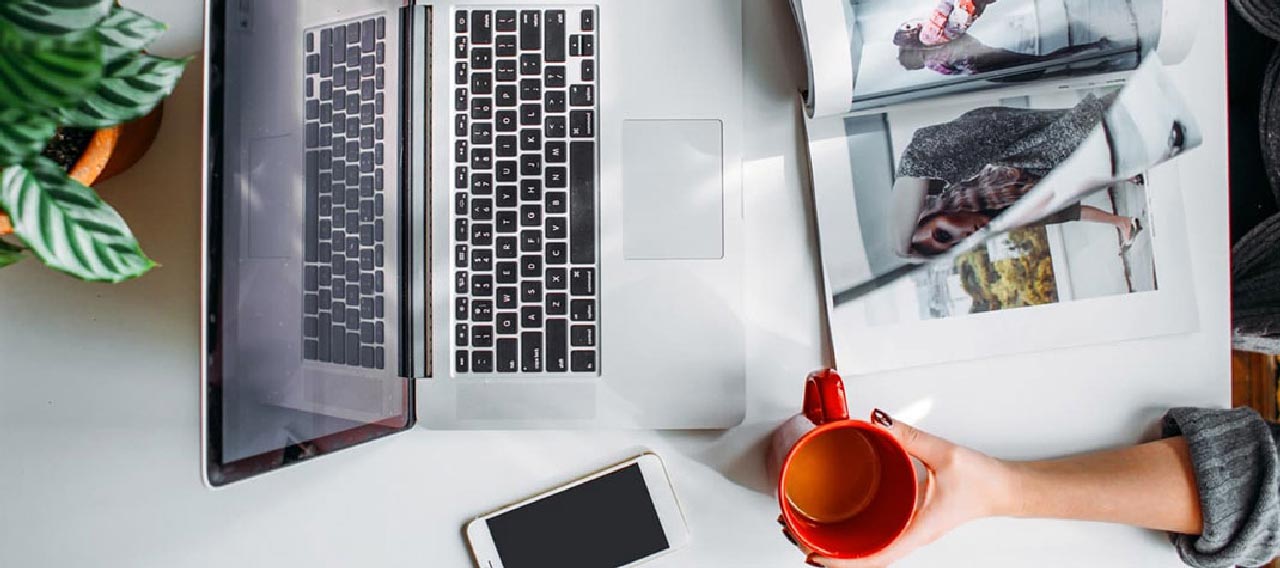 reading magazine and drinking coffee