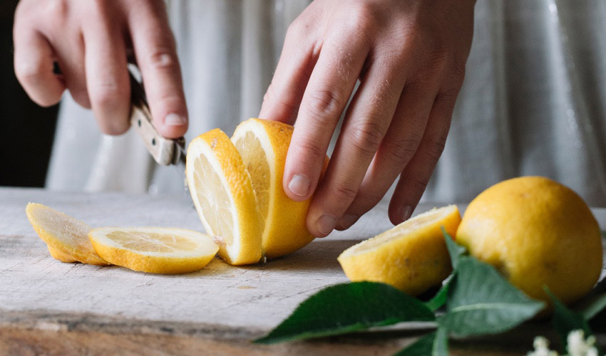 slicing a lemon