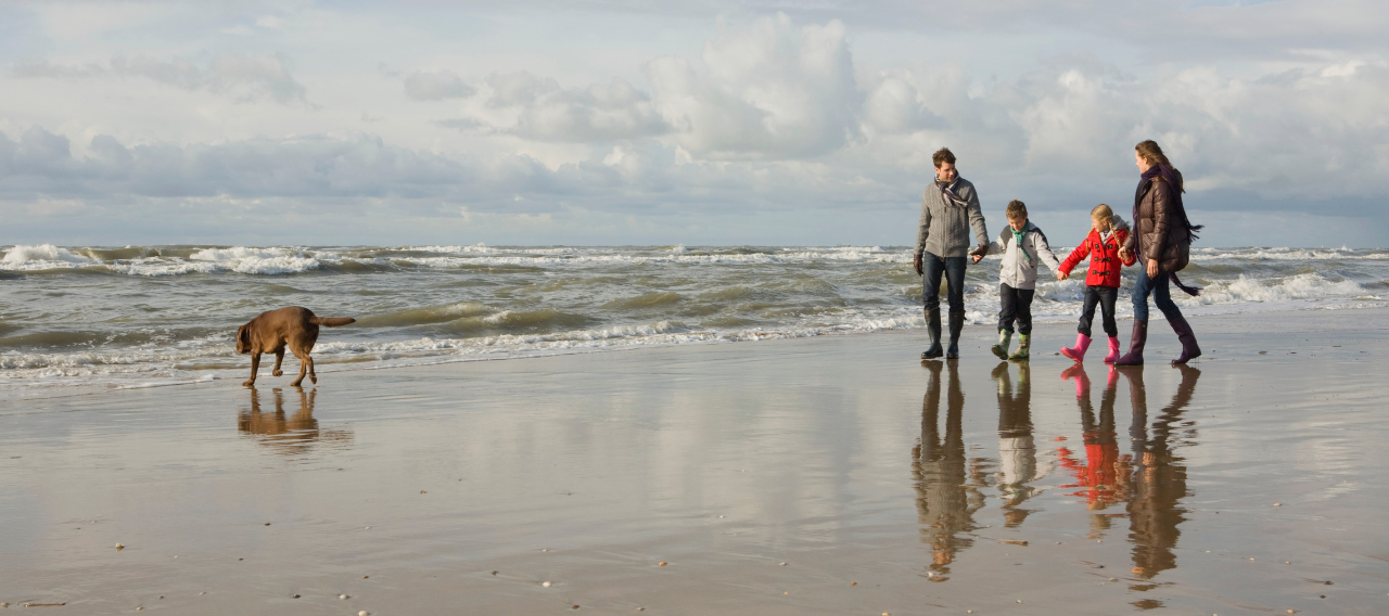 family walking on beach